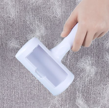 Double-sided hair removing brush
